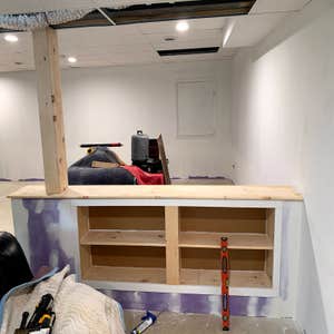 knee wall with bookcase knee wall built with 4 bookshelves to load bearing column in basement