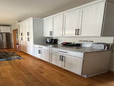 Photos by Lvs Revival Inc #1 Remove existing cabinet design and provide new cabinets. Install new cabinets and granite countertop. Hook up sink and app