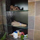 Tempered glass shelves with recycled glass tiles