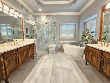 Photos by Trublue of Allen #33 Full master bathroom remodeling. New curb-less shower, bench, niches, freestanding tub, lighting, flooring, painting, co