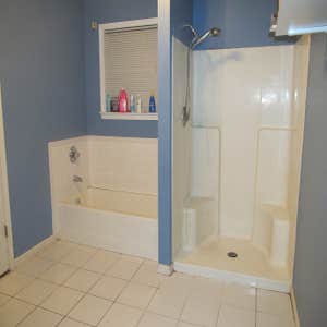 Custom Master Bath Remodel Custom master bath remodel including new ceramic tile floor, new drop-in 42x60 tub with ceramic tile install, and 4x6...