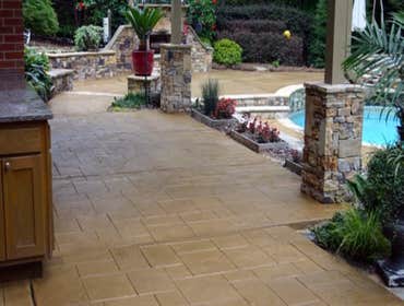 Photos by Stamped Concrete Denver LLC #1 Stamped concrete, often called textured or imprinted concrete, replicates the look of many different stones su
