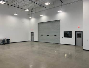 SD Composites Warehouse 2000 SF clean room in warehouse. New lighting, walls, polished floors, new AC and roll up door.