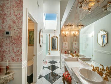 Vintage Glam: Pink, Gold & Crystal Bathroom Transformation This remodel celebrates classic European glamour with a fresh, romantic twist. From crystal 