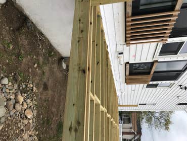 Photos by Cross Cut Carpentry & Remodeling #2 Newly framed 18’x24’ deck in Hull , wrapped in Versatex pvc and . Fiberon composite decking and railing s