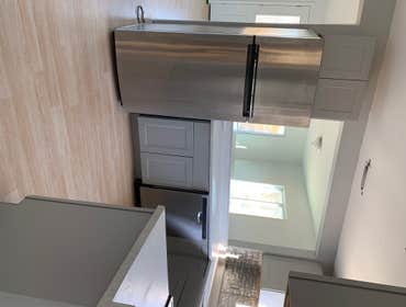 Photos by Head to Toe Home Improvement #2 The house only had a very tiny kitchen so we completely removed it and built a new specious kitchen with upda