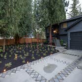 Driveway with concrete and custom interlocking pavers Low voltage lighting and planting. Redmond, Issaquah. Kirkland WA.