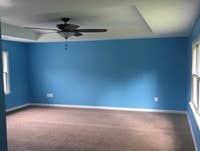 Master bedroom as part of 2nd story addition with tray ceilings