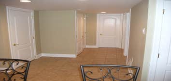 Bordentown Basement 1 Finished basement with gym, powder room, rec room, laundry, and wet bar