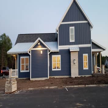 New Home CertainTeed Landmark pewter colored Shingles.
McElroy 16inch White 26ga snap lock standing seam.
