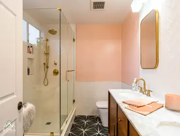 Studio City Bathroom Remodel We turned this Studio City bathroom into your mid-century modern gem! Picture a warm wood double vanity with brass handles