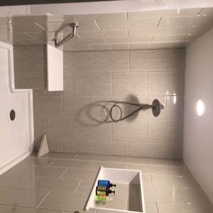 Photos by Battles Home Improvement Co Inc #1 Custom walk in shower complete with bench seat, recessed shampoo shelf, foot rest, safety bars and a...