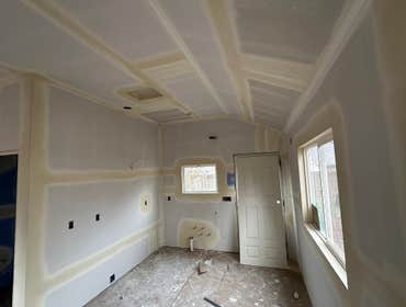 Photos by AE Drywall Specialist #3 New drywall on this ADU. Hang, windows wrap, tape, mud, and orange peel texture on walls and ceiling.