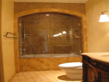 Photo(s) from Wagner Tile & Plumbing Granite Shower, Arched Valance, Marble Pinwheel Floor