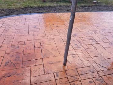 Photos by Stamped Concrete Denver LLC #1 Stamped concrete, often called textured or imprinted concrete, replicates the look of many different stones su