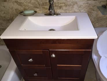 Bathroom (Complete Basement Renovation) A complete renovation of a existing basement; Bathroom, living room, Bedroom, exercise room, Laundry room, etc