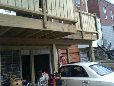 Photo(s) from Laur Moor Construction Two decks and a tiled kitchen floor