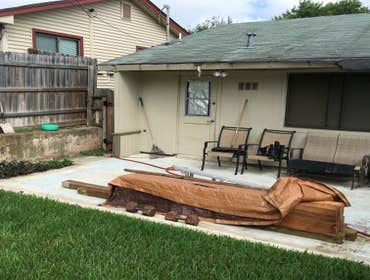 Roofing job, with exterior patio cedar beams.