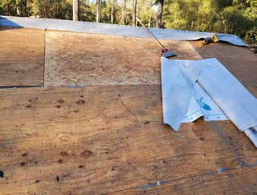 Photos by Service Restoration Pros LLC #1 A tree fell through the roof of this 3 bedroom house during Hurricane Ida. It left several gaping holes and a