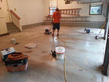 Photo(s) by Home Pride Contracting LLC Stripping and painting a 3 car garage floor.