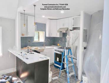Lisa's Kitchen & Bathroom Renovation The clients have a big family, so the space needed to be reconfigured to accommodate that.Alongside the new floors