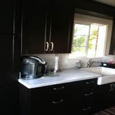 Photos by PS Carpentry LLC #1 The kitchen pictures, I hung and placed cabinetry in a galley kitchen. The deck pictures, we removed a couple beams and 