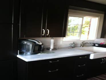 Photos by PS Carpentry LLC #1 The kitchen pictures, I hung and placed cabinetry in a galley kitchen. The deck pictures, we removed a couple beams and 